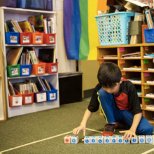 NYTimes image of child playing with digitally enhanced sequencing blocks